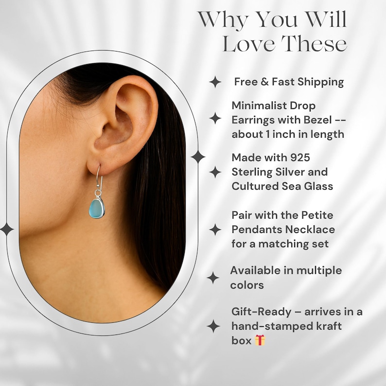 May include: Minimalist drop earrings with a bezel, featuring a light blue cultured sea glass stone. The earrings are approximately 1 inch in length and made with 925 sterling silver. The image also includes text.