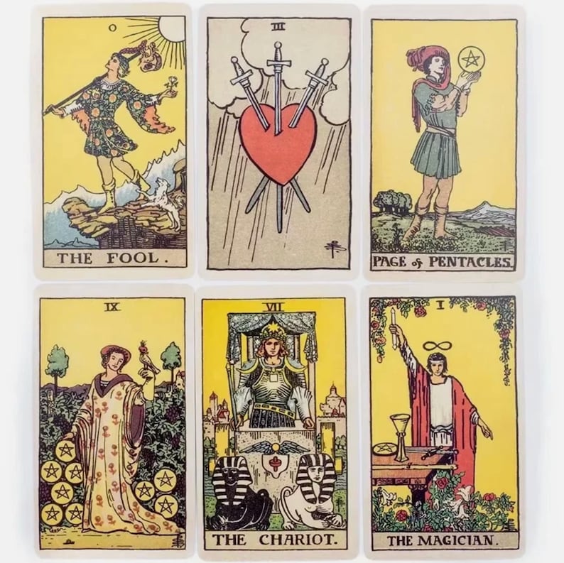 Rider Waite tarot cards layout showing The Fool, Three of Swords, Page of Pentacles, The Chariot and The Magician