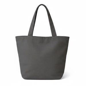 May include: A solid gray tote bag with two matching handles. The bag is made of a sturdy material and has a simple, minimalist design. The tote bag is suitable for carrying groceries, books, or other items.