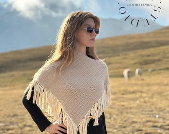 May include: A beige crochet poncho featuring a triangular shape with long fringe trim along the bottom edges. The text CROCHET PONCHO, A DIGITAL PATTERN BY PERRI.STUDIO CROCHET DESIGN is displayed in the upper portion of the image.