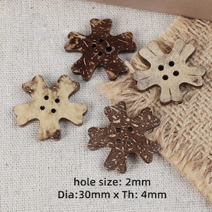 May include: Four flower-shaped buttons in varying shades of brown, each featuring four central holes. The buttons measure 30mm in diameter and 4mm in thickness, with a 2mm hole size. The text "hole size: 2mm Dia:30mm x Th: 4mm" is visible.
