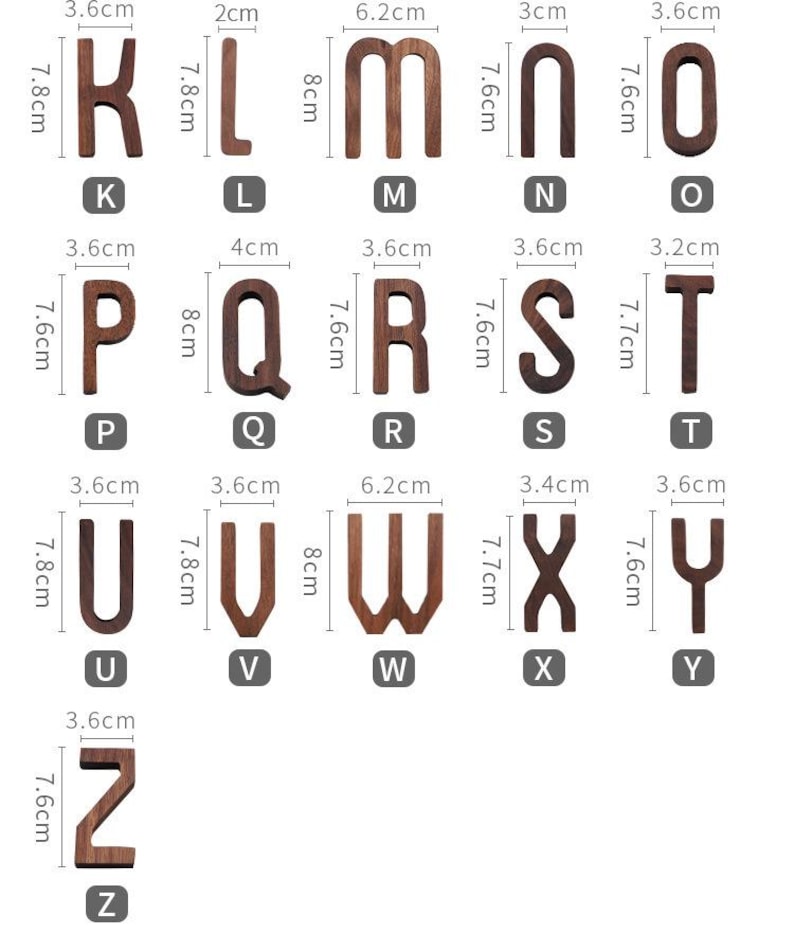May include: Wooden alphabet letters, each with measurements in centimeters, arranged on a white background. The letters range in size, with the letter 'M' being 8 cm tall and 6.2 cm wide. The letters are in a dark brown color.