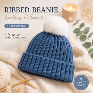 May include: A blue ribbed beanie with a white pom-pom, displayed on a cream-colored knitted surface. The image includes text that reads "Ribbed Beanie Knitting Pattern" and "Pom Pom Hat". A candle and yarn are also visible.