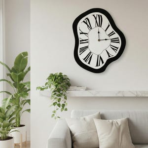 May include: A distinctive wall clock with a black frame and a white face. The clock has a melting, irregular shape and features black Roman numerals. The hands of the clock indicate the time. The clock is mounted on a white wall.