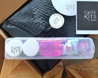 Travel Light Compact Cosmetics Kit: Mini Skincare, oils and serum dropper containers in a must have mini beauty travel set. Gift packaged.