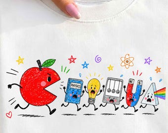 May include: A white crewneck sweatshirt featuring a colorful graphic of a large red apple chasing a blue physics book, a yellow lightbulb, a Newton's cradle, a red and blue magnet, and a triangular prism with a rainbow spectrum.
