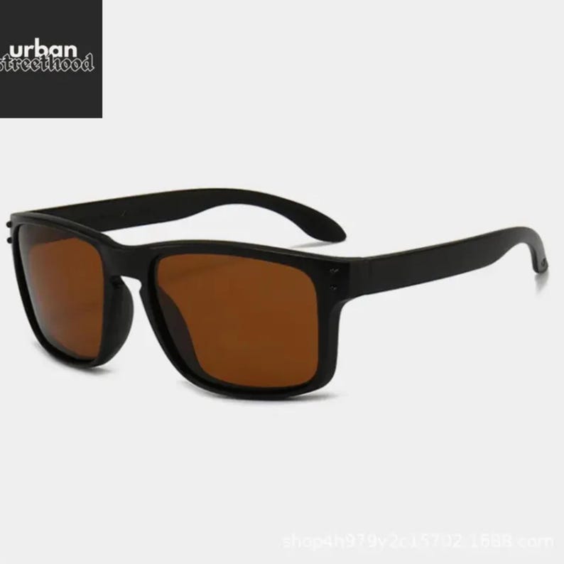 May include: Black sunglasses with brown lenses. The sunglasses have a rectangular frame and curved arms. The text "urban streetfood" is in the upper left corner.