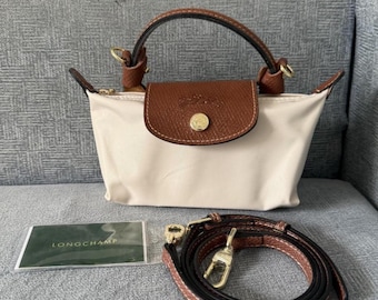 Bolso bandolera mini Longchamp color crema Incluye correa para el hombro