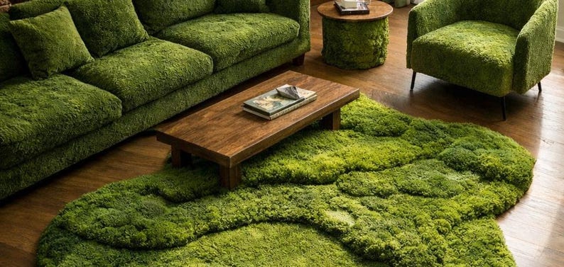 May include: A living room set featuring a green moss-like rug, sofa, armchair, and side table. A rectangular wooden coffee table sits atop the rug. The furniture has a textured, plush appearance, creating a unique and natural aesthetic.