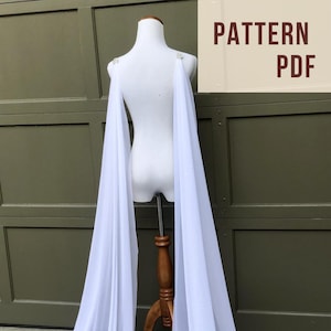 two separate long trailing white chiffon pieces of fabric hanging down mannequin, bridal wing veil alternative for brides without wedding dress train