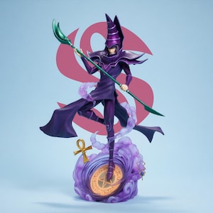 May include: A purple figurine of a character with a tall hat and staff. The figure is standing on a swirling purple base with a golden emblem. The staff has a green blade. The background is light blue with a pink design.