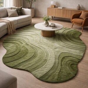 May include: A green area rug with a unique, organic shape. The rug features a wave-like pattern in varying shades of green, creating a textured, three-dimensional effect. This decorative rug adds a modern touch to any living room.