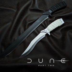 May include: A set of three ceramic canisters with lids. The canisters are white with a blue floral pattern. The largest canister is 8 inches tall, the medium is 6 inches, and the smallest is 4 inches.