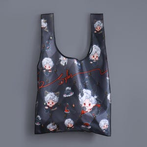 May include: A black reusable tote bag with a white and red design featuring cartoon characters. The bag has the word "Stylus" written in white on a red background.