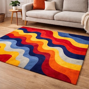 May include: A colorful area rug with a wavy pattern in shades of red, orange, yellow, blue, and gray. The rug is rectangular and placed on a hardwood floor, adding a vibrant touch to the room's decor.
