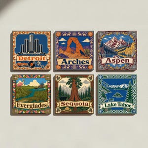 May include: A set of six square wall art prints featuring illustrations of Detroit, Arches, Aspen, Everglades, Sequoia, and Lake Tahoe. Each print displays a distinct landscape or city scene with a decorative border and the location name in text.