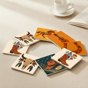 May include: A collection of square coasters with a Western theme. Each coaster displays a different design, including a steer skull, cowboy boots, a horse, a guitar, a horseshoe, and a cowboy hat. The coasters have a cream background with orange, brown, and teal accents.