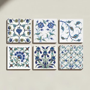 May include: A set of six square ceramic tiles arranged in two rows of three. Each tile features a white background with intricate botanical patterns in shades of blue, green, and red, including floral motifs, grape clusters, and geometric vines.