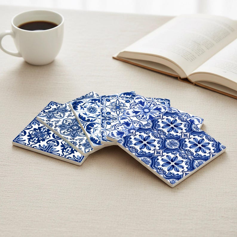 Ceramic tile coasters arranged on a table, inspired by traditional Portuguese blue azulejo patterns
