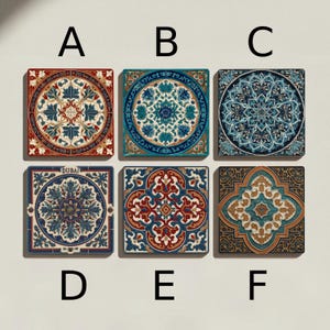 May include: Six square decorative tiles with intricate patterns. The tiles feature a variety of designs, including floral and geometric motifs, in colors like red, blue, and gold. The tile labeled "D" has the word "DUBAI" on it.