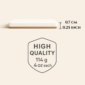 May include: A rectangular white coaster with a cork base. The coaster is 0.25 inches thick and weighs 4 oz. The text "HIGH QUALITY" is displayed above the weight information.