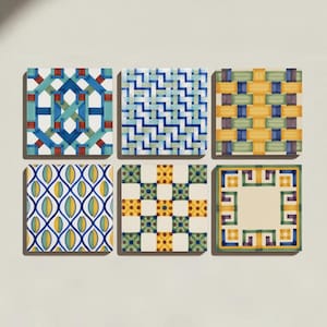 May include: A set of six square ceramic tiles arranged in two rows of three. Each tile features a distinct geometric pattern in various colors including blue, green, yellow, red, and cream. The designs include woven, grid, and border motifs.