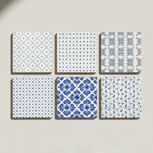 May include: A set of six square coasters featuring distinct patterns. The designs include a green and blue geometric grid, a thin blue crosshatch, a red and blue floral stripe, a blue diamond grid, a blue botanical motif, and a blue floral vine.