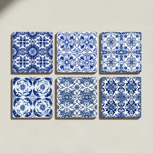 Close-up of a ceramic coaster featuring hand-painted style cobalt blue floral motifs on white glaze