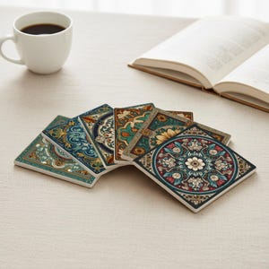 May include: Six square ceramic coasters with detailed floral and geometric designs in teal, blue, green, and red. A white coffee cup and an open book are in the background.