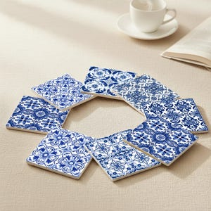 Classic table decor with blue and white ceramic coasters reflecting historic Portuguese tilework