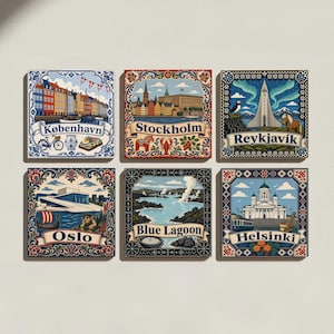 May include: A set of six square decorative tiles featuring colorful illustrations of Nordic landmarks and cities. Each tile displays a specific location name: København, Stockholm, Reykjavík, Oslo, Blue Lagoon, and Helsinki, framed by intricate borders.