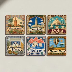 May include: A set of six square decorative tiles featuring colorful travel illustrations of Marrakech, Casablanca, Doha, Fez, Beirut, and Maasai Mara. Each tile displays a landmark, a banner with the city name, and intricate border patterns.