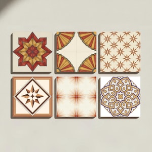 May include: A set of six square ceramic tiles arranged in two rows. Each tile features a distinct geometric pattern in colors including red, yellow, brown, white, and purple. The designs include starbursts, fan shapes, and intricate floral motifs.