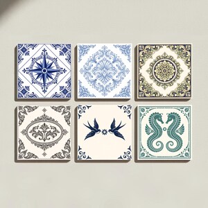 May include: A set of six square ceramic tiles featuring diverse patterns: a blue compass rose, a blue floral scrollwork, a gold and black mandala, a black oval filigree, two blue swallows, and two teal seahorses on a cream-coloured background.