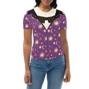 May include: A purple short-sleeved shirt with a white collar and a black bow tie. The shirt has a pattern of stars, moons, and yin-yang symbols.