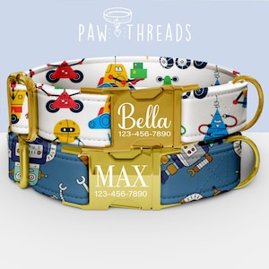 May include: Two personalized dog collars with gold-colored buckles. One collar is white with colorful robot designs, the other is blue with robot patterns. The collars are labeled "Bella" and "MAX" with phone numbers.