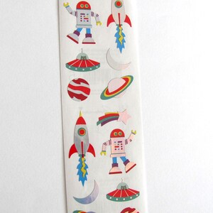 May include: A sheet of colorful space-themed stickers featuring robots, rockets, planets, stars, and UFOs.