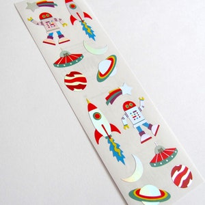 May include: A sheet of colorful space-themed stickers featuring robots, rockets, planets, stars, and UFOs. The stickers are perfect for adding a fun and whimsical touch to any project.