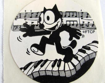 Katten Felix dansar på ett piano sällsynt vintage klistermärke - 80-talets tidiga Lisa Frank tecknad kattunge kattunge musiknoter keyboard