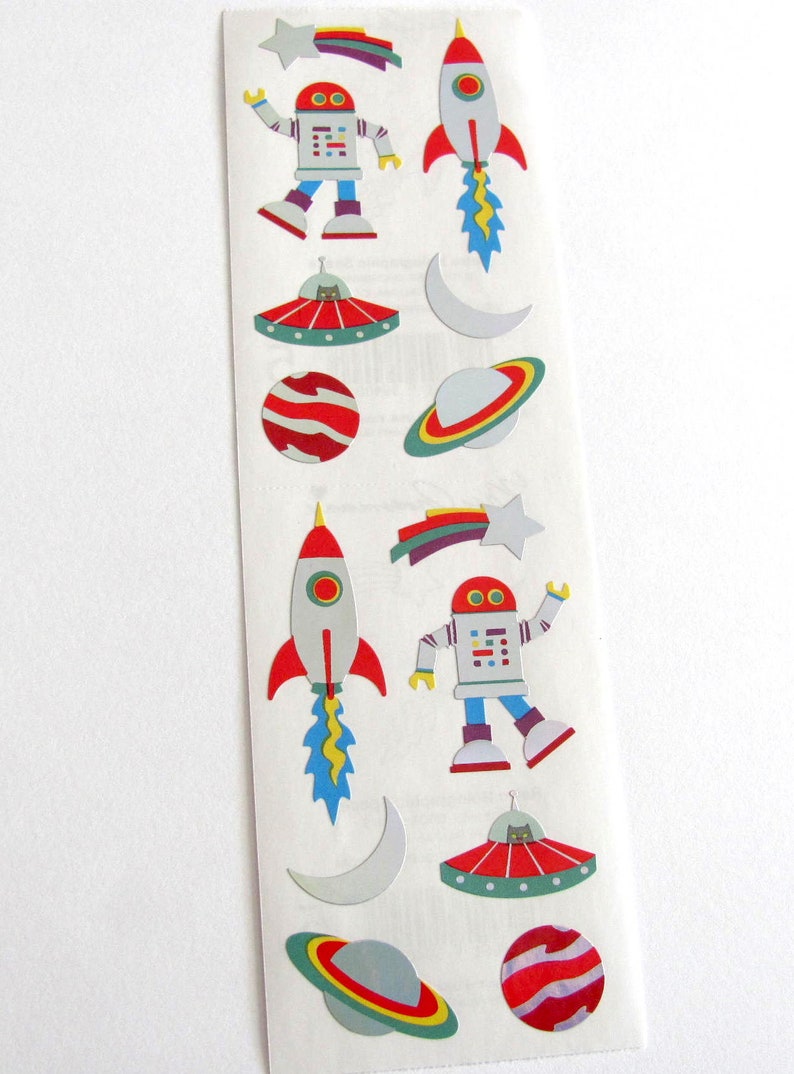May include: A sheet of colorful space-themed stickers featuring robots, rockets, planets, stars, and UFOs.