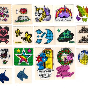 May include: A sheet of vintage holographic stickers featuring various designs, including a unicorn, a rainbow, a frog, a bee, a star, a castle, a birthday message, and a good night message.