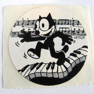 Adesivo vintage raro Felix il gatto che balla su un pianoforte - Gattino dei cartoni animati di Lisa Frank degli anni '80 con note musicali sulla tastiera