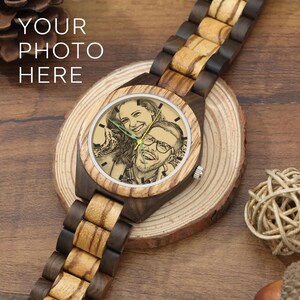 May include: A wristwatch with a two-tone wooden link band and a round wooden case. The watch face features a custom engraved black and white portrait of a smiling couple. The text "YOUR PHOTO HERE" is visible in the upper left corner of the image.