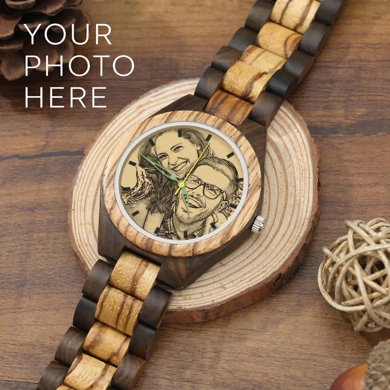 May include: A wristwatch with a two-tone wooden link band and a round wooden case. The watch face features a custom engraved black and white portrait of a smiling couple. The text "YOUR PHOTO HERE" is visible in the upper left corner of the image.