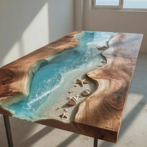 May include: A handcrafted wooden table with a river design. The centre features clear blue resin, resembling water, with embedded seashells and starfish. The table's edges are natural wood, and it has metal legs.