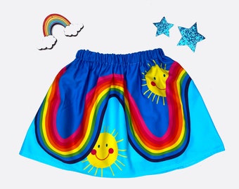 Rainbow play skirt in blue cotton with happy sunshine face, sizes 1y,2y,3y,4y,5y,6y,7y,8y