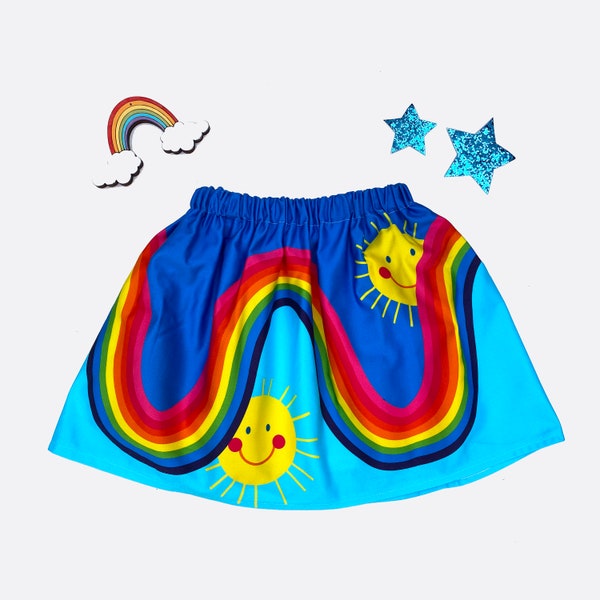 Rainbow play skirt in blue cotton with happy sunshine face, sizes 1y,2y,3y,4y,5y,6y,7y,8y