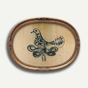 May include: An oval-shaped framed artwork featuring a blue and white bird design. The bird is depicted with a dotted body and a stylized tail. The frame is gold-colored with ornate detailing, adding a vintage aesthetic.