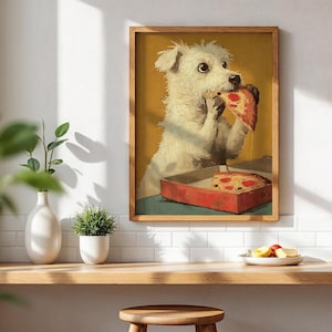 May include: A framed print shows a white dog enjoying a slice of pizza from a red box. The dog has a surprised expression. The background is yellow, and the print is in a wooden frame. The image is on a white wall, above a wooden shelf.