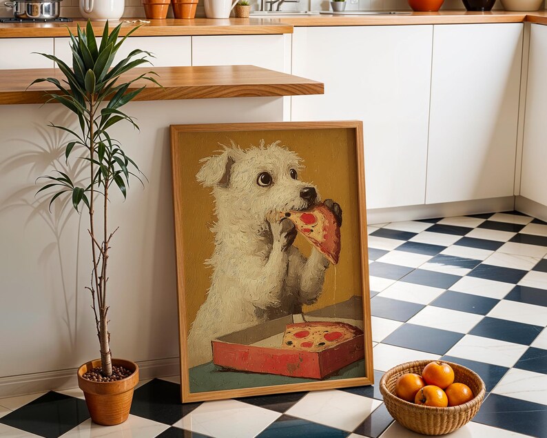 May include: A framed print shows a white dog enjoying a slice of pizza from a red box. The artwork has a vintage style, with a warm color palette. A small potted plant and a basket of oranges are in the foreground.